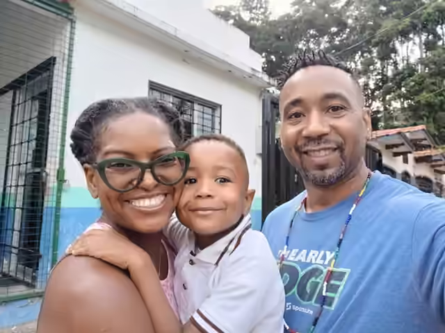 A family photo of Jarrad, Yenory, and Sage